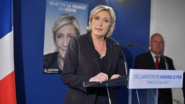 French candidates halt campaigns; Le Pen calls for border controls